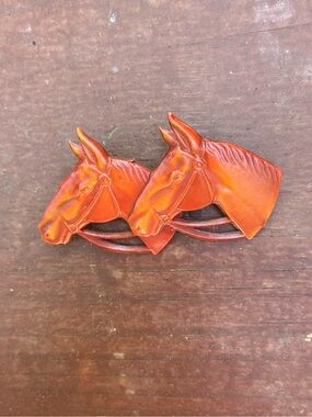 Two horse head pin made of celluloid